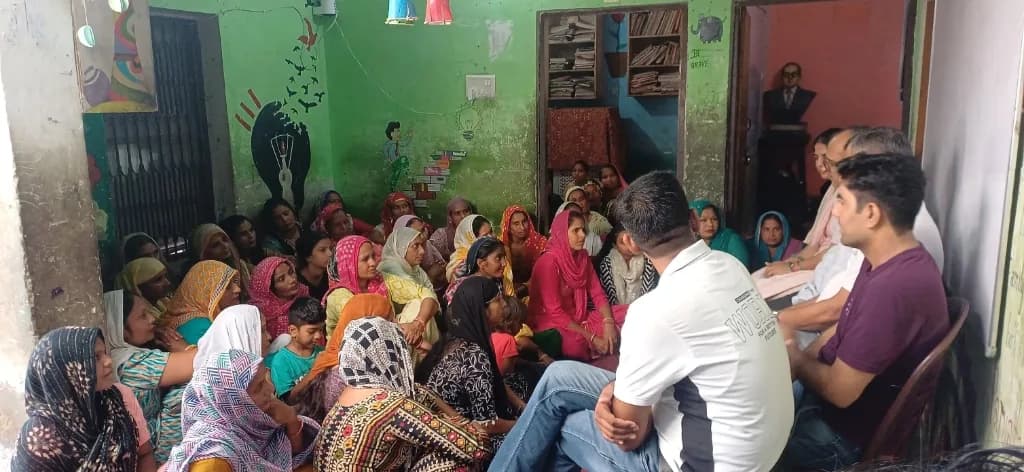 Women and girls at a community meeting at the Paryatan Foundation centre